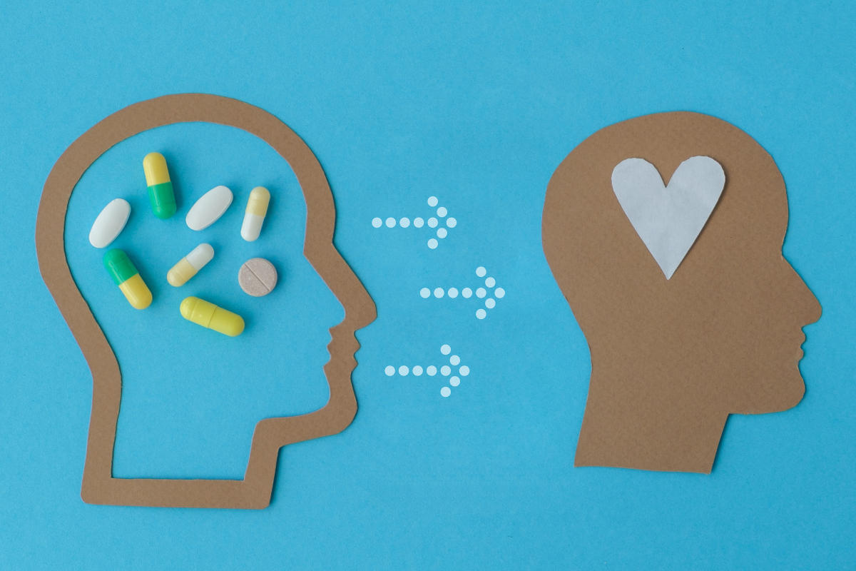Mental health concept in craft paper showing medicine resulting in a happy brain