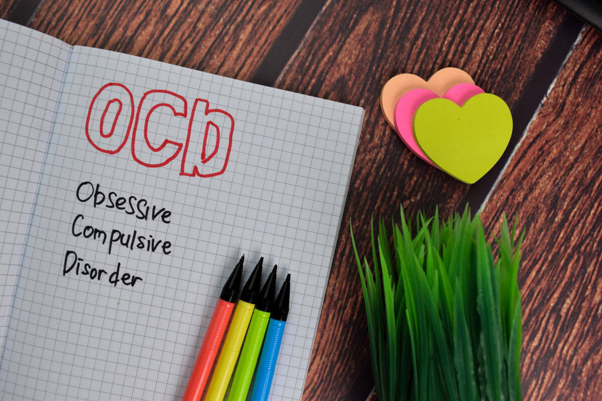Text on graph paper: 'OCD Obsessive Compulsive Disorder'