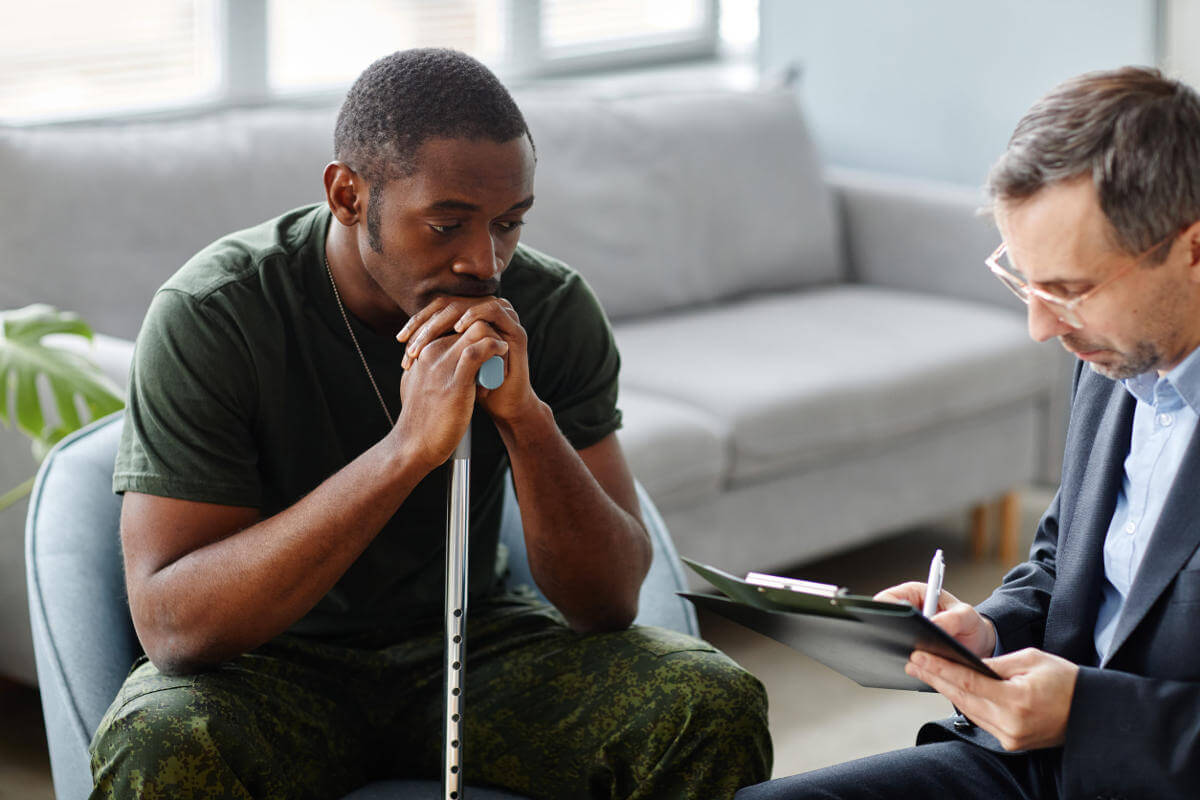 Soldier with cane seeking treatment for Post Traumatic Stress Disorder (PTSD)