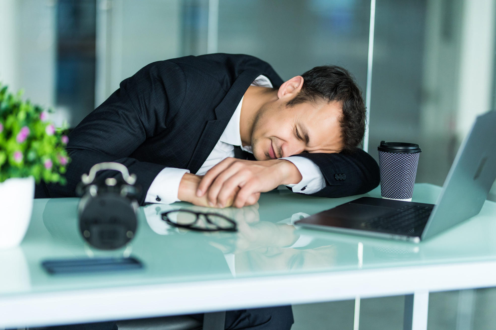 Man who fell asleep at his work desk