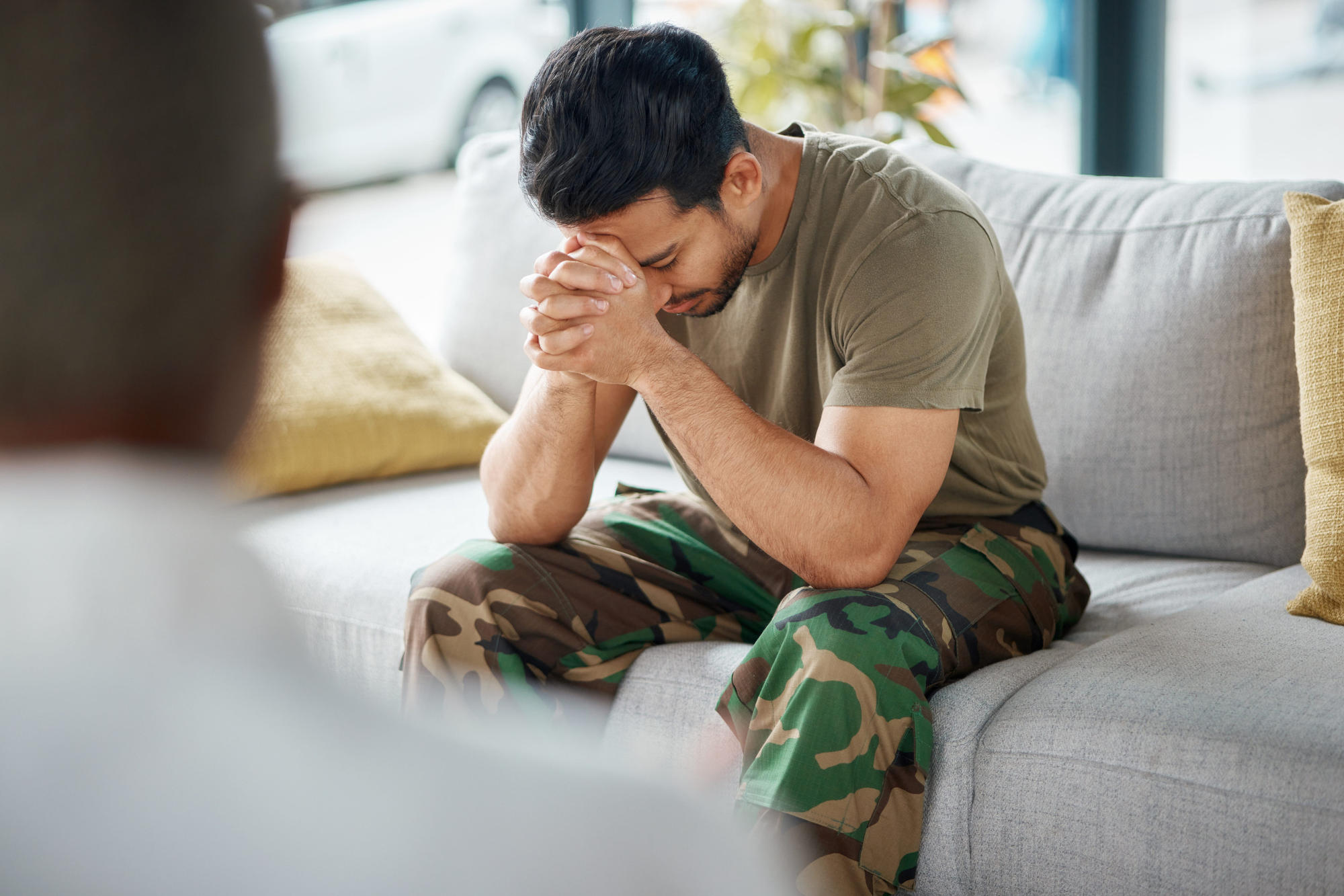 Male soldier in therapy for mental health and stress after military service