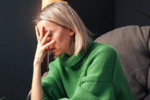 Middle age Sad Woman at Home With Depression.